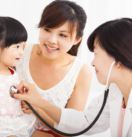Doctor Checking A Child — Your Family Practice in Laurieton, NSW